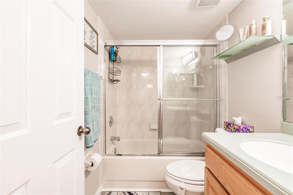 175 Kings Highway, Unit 538 Punta Gorda, FL 33983 - Photo 28 of 46 a bathroom with a bathtub shower sink vanity and toilet