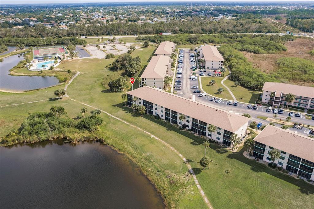 175 Kings Highway, Unit 538 Punta Gorda, FL 33983 - Photo 33 of 46 an aerial view of a house with a lake view