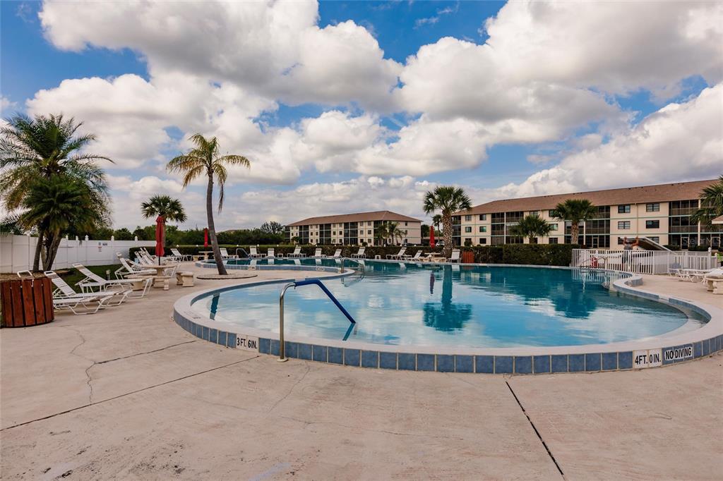 175 Kings Highway, Unit 538 Punta Gorda, FL 33983 - Photo 40 of 46 a view of swimming pool with outdoor seating