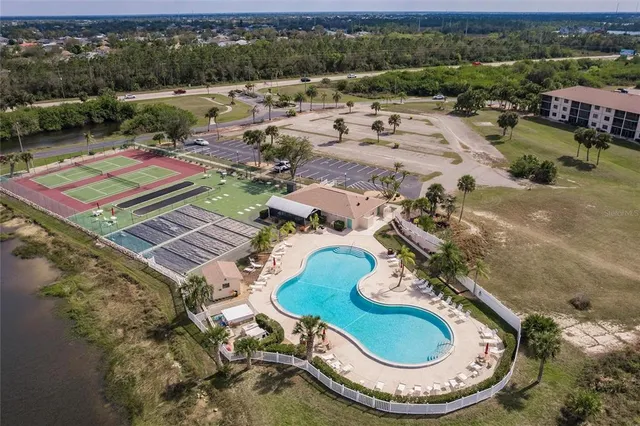 an aerial view of a house with a swimming pool