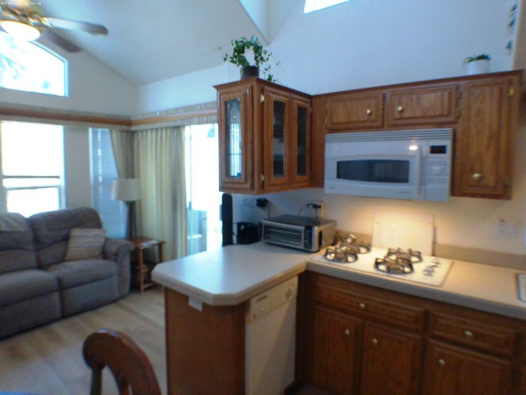 84136 Ave 44, Unit 582 Indio, CA 92203 - Photo 21 of 56 a kitchen with a sink cabinets and window