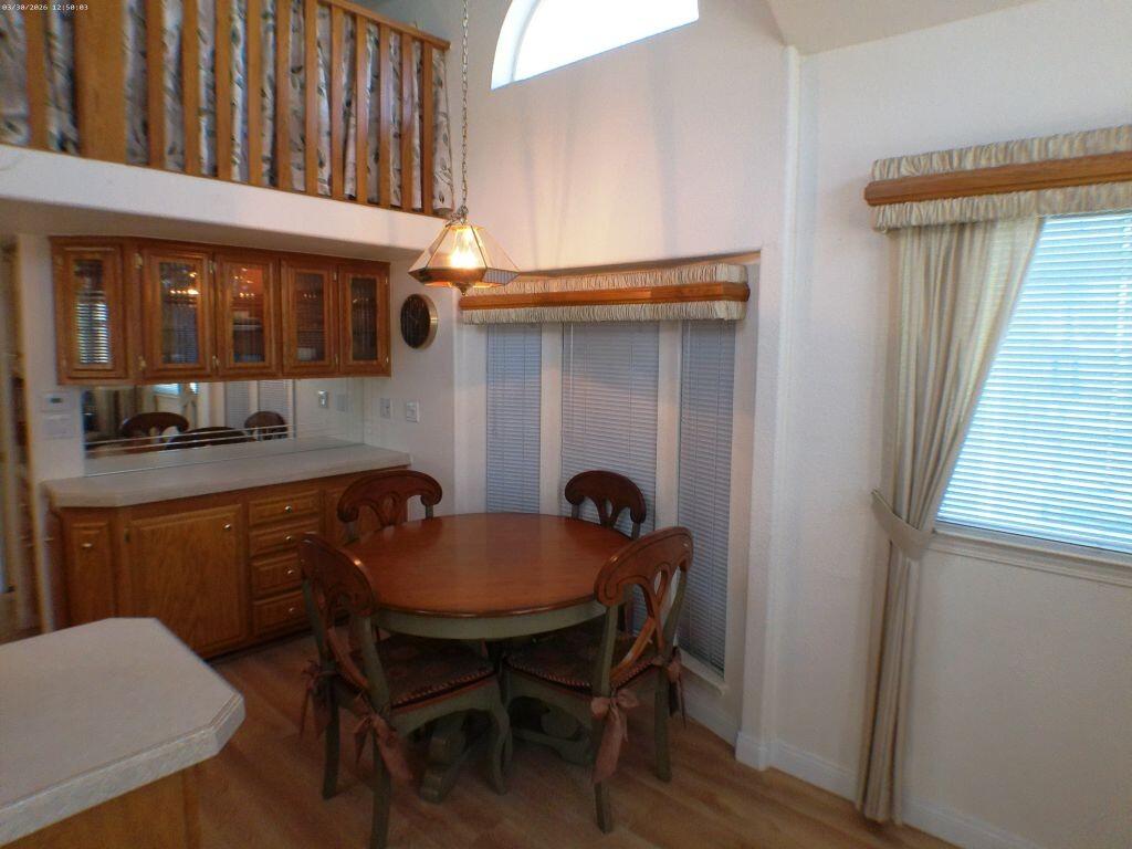 84136 Ave 44, Unit 582 Indio, CA 92203 - Photo 28 of 56 a dining room with furniture and window