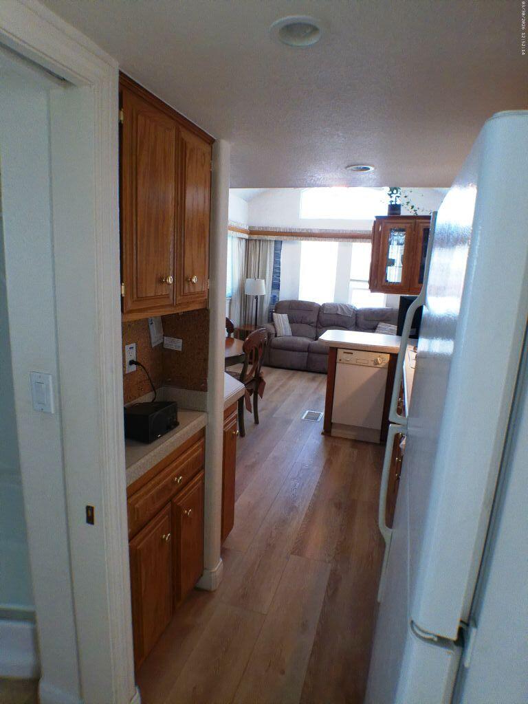 84136 Ave 44, Unit 582 Indio, CA 92203 - Photo 31 of 56 a living room with furniture and a flat screen tv