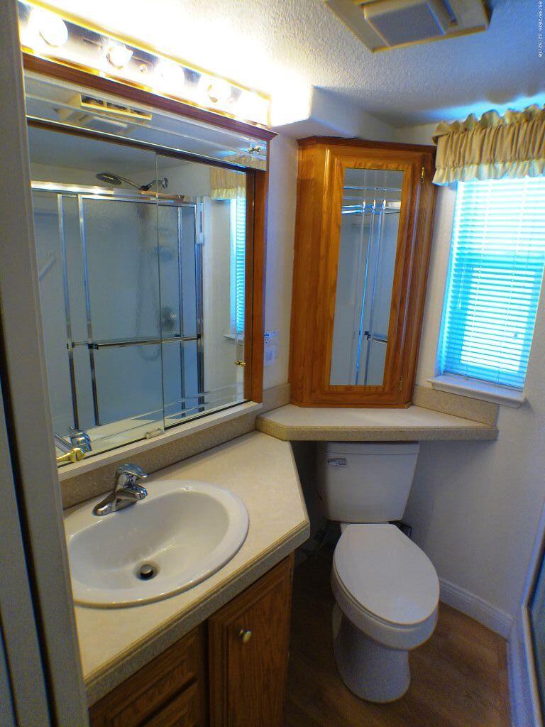 84136 Ave 44, Unit 582 Indio, CA 92203 - Photo 36 of 56 a bathroom with a sink and a mirror