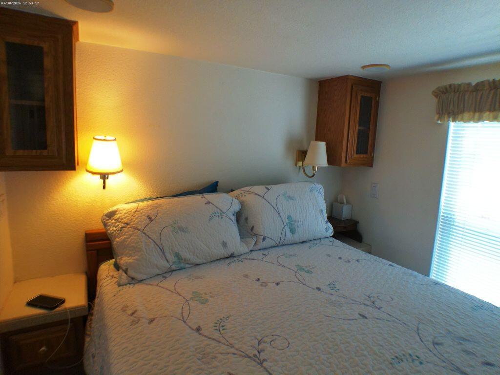 84136 Ave 44, Unit 582 Indio, CA 92203 - Photo 40 of 56 a bedroom with a bed and a window