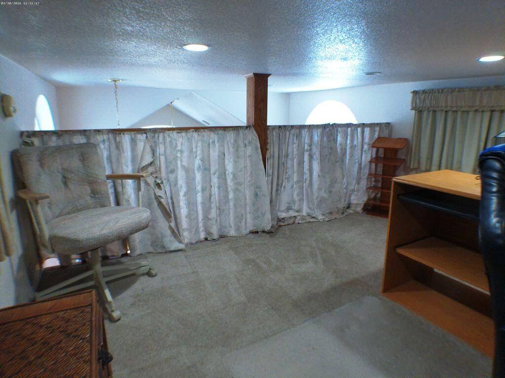 84136 Ave 44, Unit 582 Indio, CA 92203 - Photo 47 of 56 a room with furniture and a rug