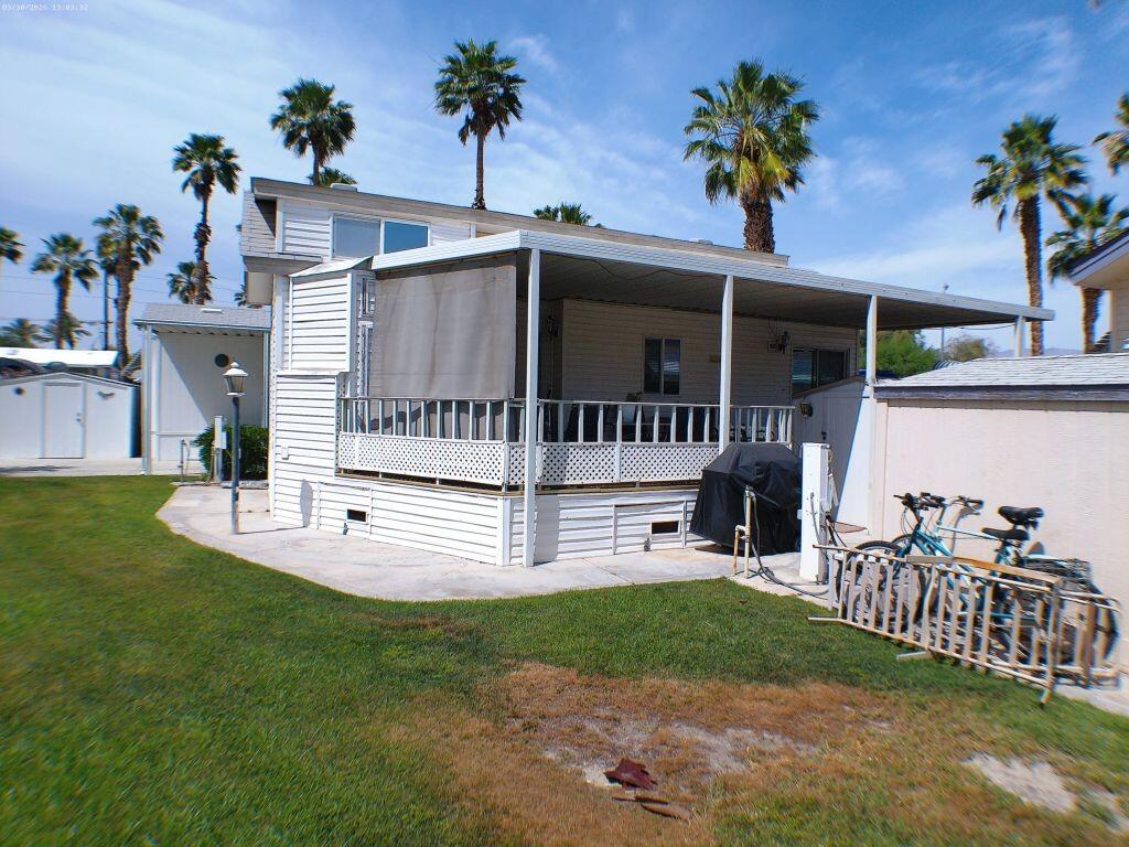 84136 Ave 44, Unit 582 Indio, CA 92203 - Photo 6 of 56 a view of a house with a yard and sitting area