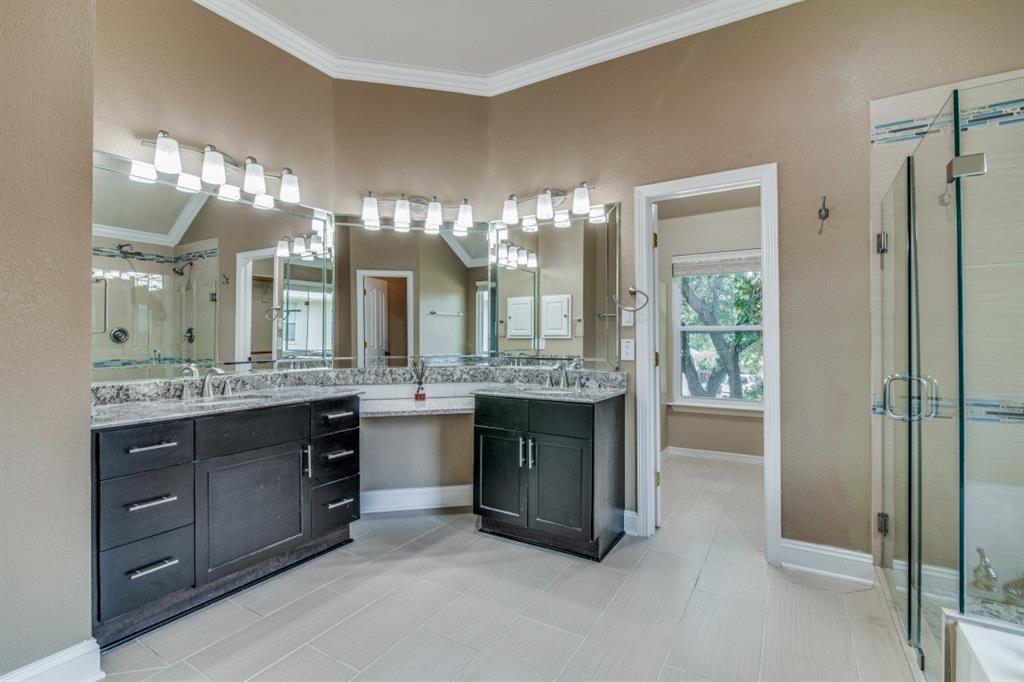 3814 Ridgecrest Avenue Rowlett, TX 75088 - Photo 11 of 24 a bathroom with a double vanity sink and a mirror