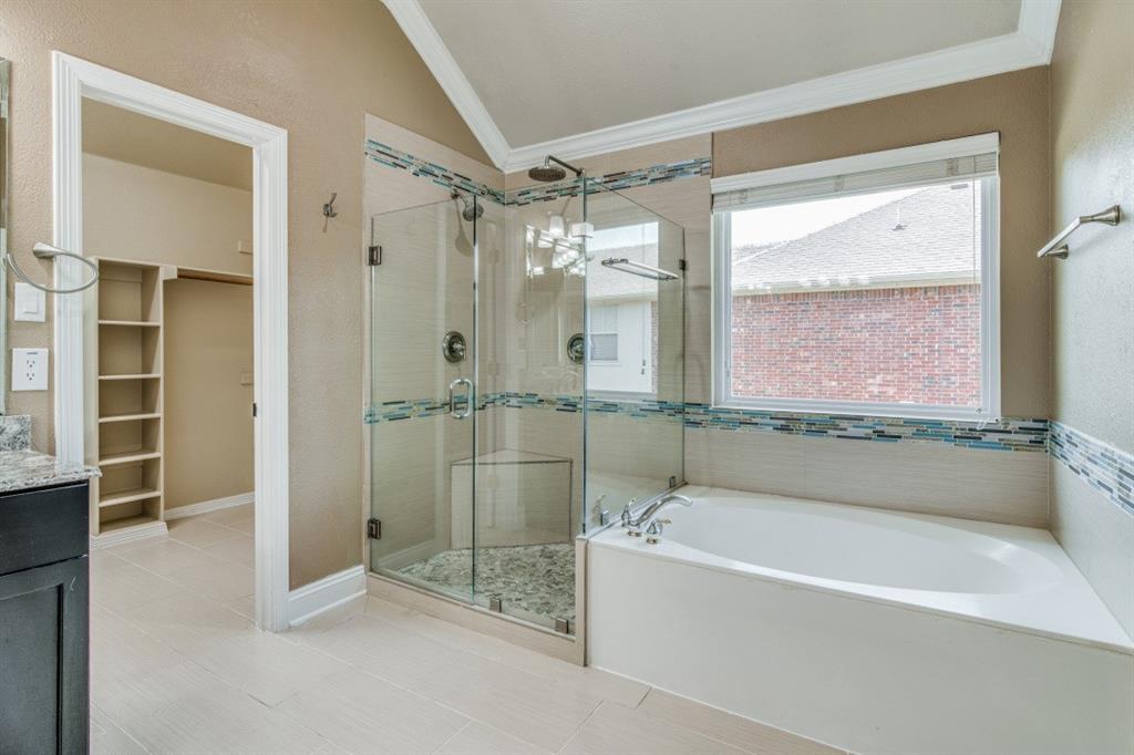 3814 Ridgecrest Avenue Rowlett, TX 75088 - Photo 12 of 24 a bathroom with a glass shower door and a shower