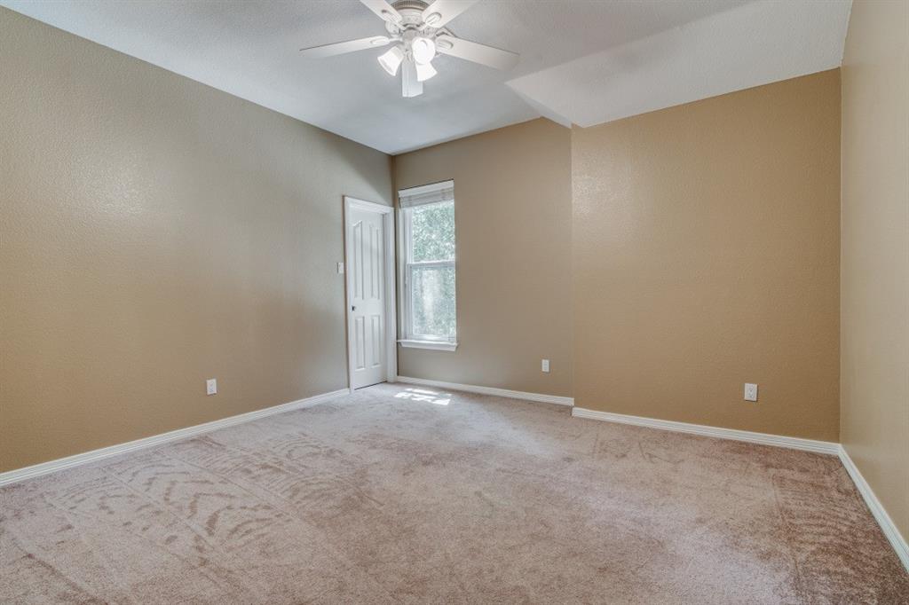 3814 Ridgecrest Avenue Rowlett, TX 75088 - Photo 16 of 24 a view of an empty room with a chandelier fan