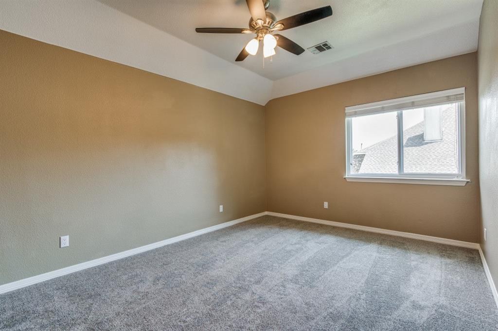 3814 Ridgecrest Avenue Rowlett, TX 75088 - Photo 18 of 24 a view of an empty room with window and chandelier fan