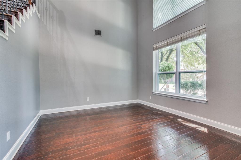 3814 Ridgecrest Avenue Rowlett, TX 75088 - Photo 4 of 24 a view of an empty room with wooden floor and a window