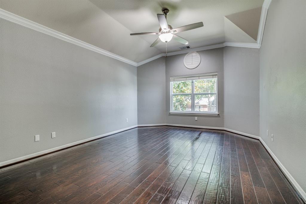 3814 Ridgecrest Avenue Rowlett, TX 75088 - Photo 10 of 24 an empty room with wooden floor chandelier fan and windows