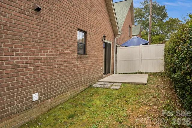 a view of a backyard of the house