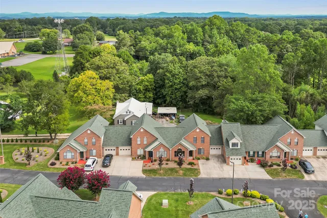 an aerial view of house with yard swimming pool and outdoor seating