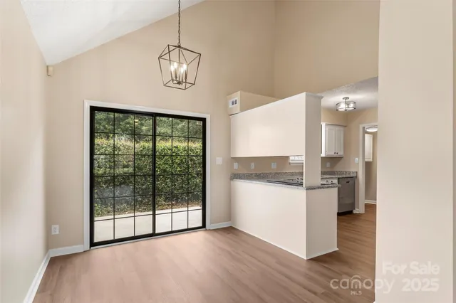 a open kitchen with a refrigerator a sink and a stove