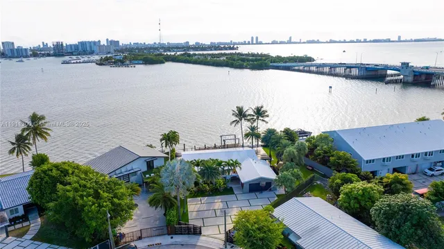 an aerial view of house with lake and lake view