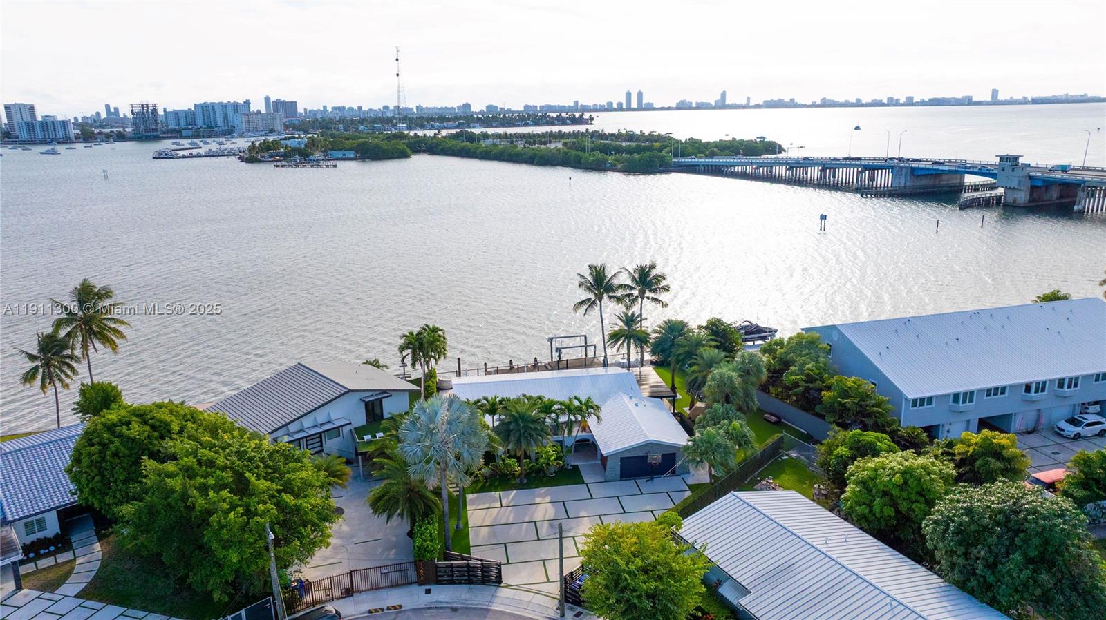 1242 Northeast 81st Terrace Miami, FL 33138 - Photo 1 of 23 an aerial view of house with lake and lake view