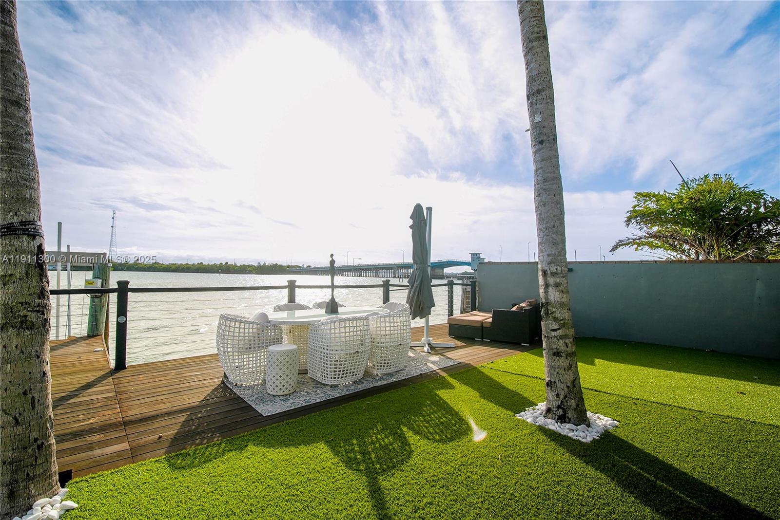 1242 Northeast 81st Terrace Miami, FL 33138 - Photo 14 of 23 a view of a ocean from a balcony with outdoor seating