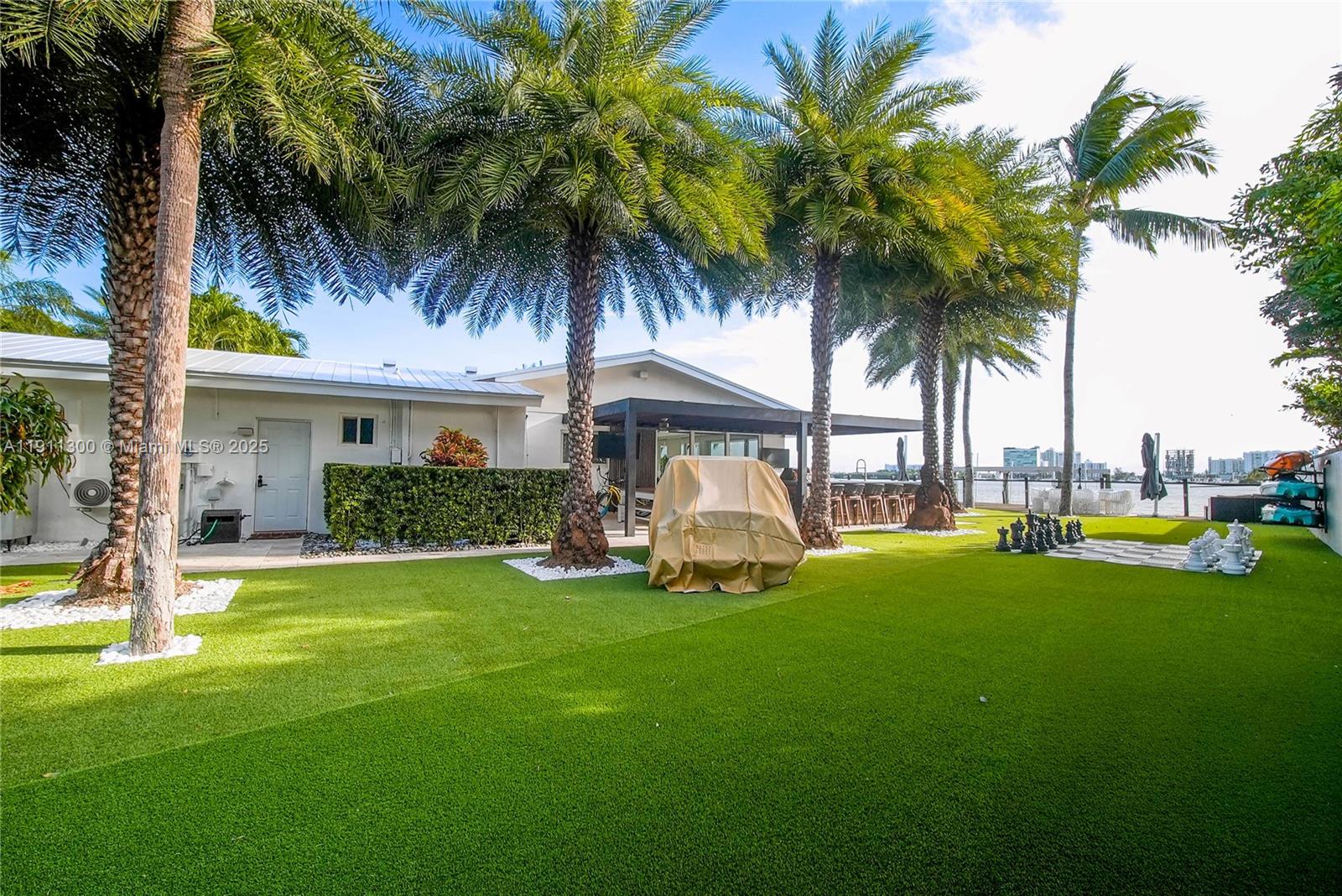 1242 Northeast 81st Terrace Miami, FL 33138 - Photo 17 of 23 a front view of house with yard and swimming pool