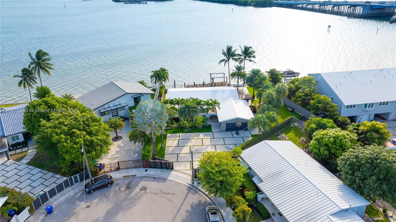 1242 Northeast 81st Terrace Miami, FL 33138 - Photo 18 of 23 an aerial view of a house with a yard and potted plants