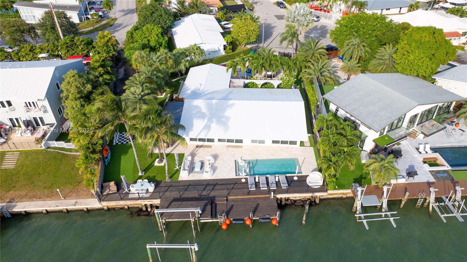 1242 Northeast 81st Terrace Miami, FL 33138 - Photo 19 of 23 an aerial view of a house with outdoor space swimming pool and outdoor seating