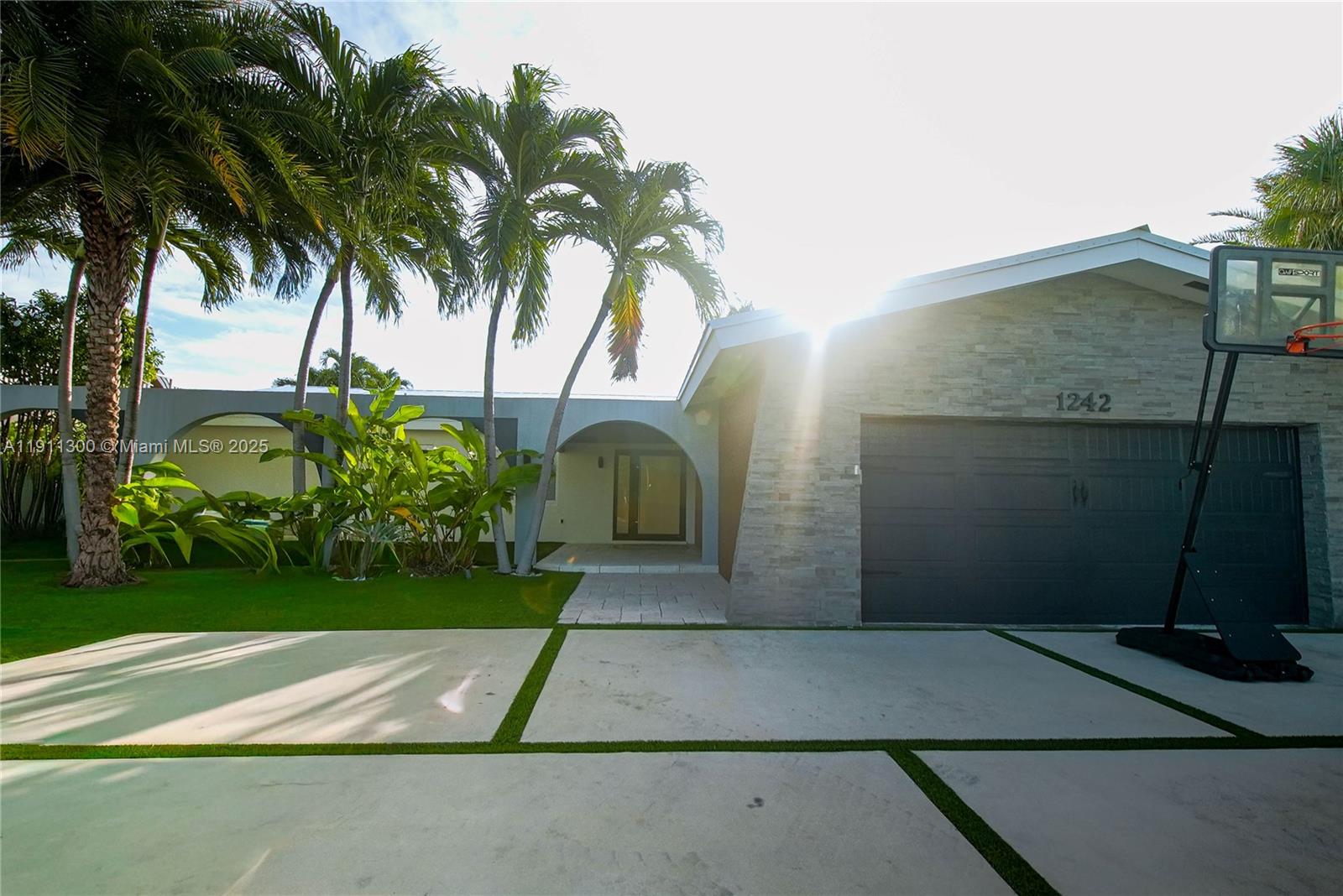 1242 Northeast 81st Terrace Miami, FL 33138 - Photo 2 of 23 a view of backyard of a house