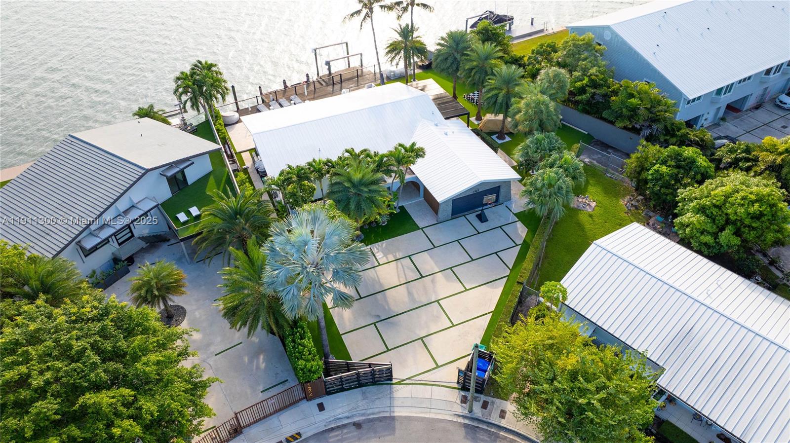 1242 Northeast 81st Terrace Miami, FL 33138 - Photo 21 of 23 an aerial view of a house with a yard and furniture