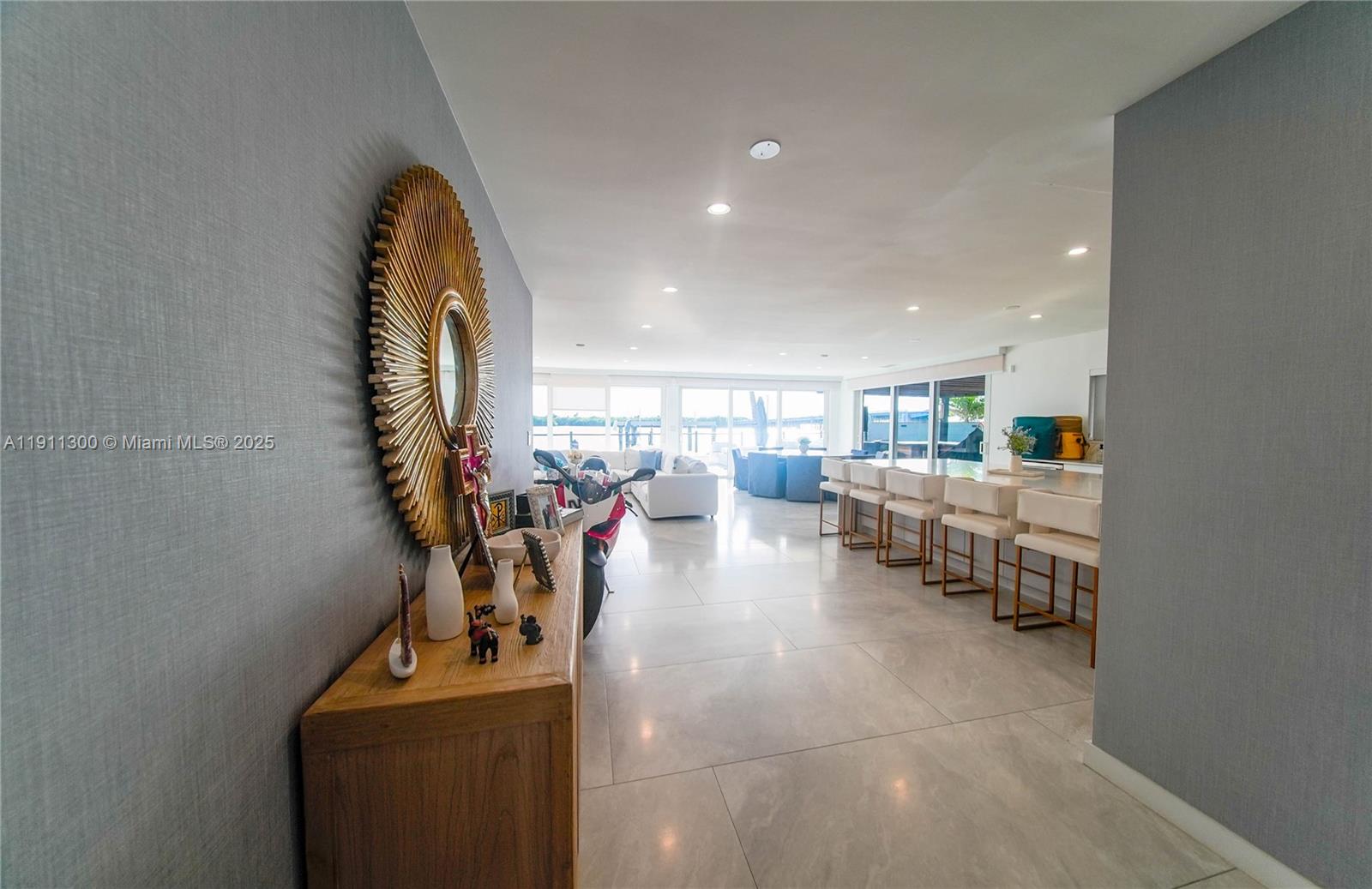 1242 Northeast 81st Terrace Miami, FL 33138 - Photo 4 of 23 a view of a room with gym equipment and lots of clutter