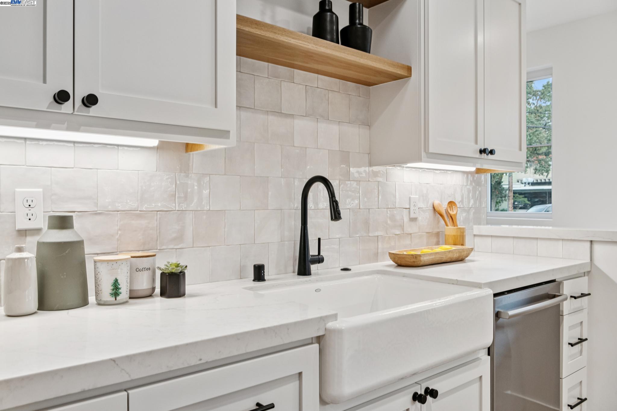 922 Brown Avenue Lafayette, CA 94549 - Photo 12 of 45 a kitchen with a sink and a potted plant on the counter
