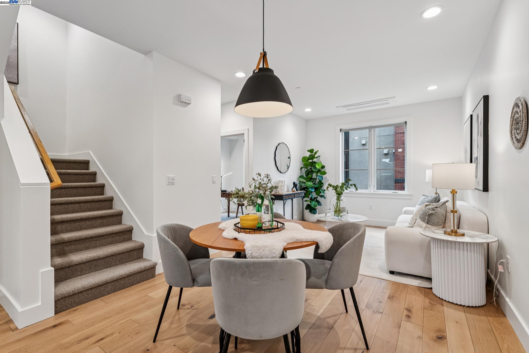 922 Brown Avenue Lafayette, CA 94549 - Photo 14 of 45 a dining room with furniture wooden floor and a chandelier