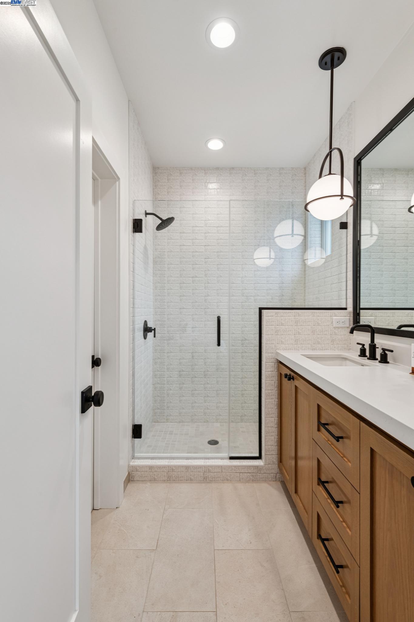 922 Brown Avenue Lafayette, CA 94549 - Photo 25 of 45 a bathroom with a double vanity sink a mirror and a shower