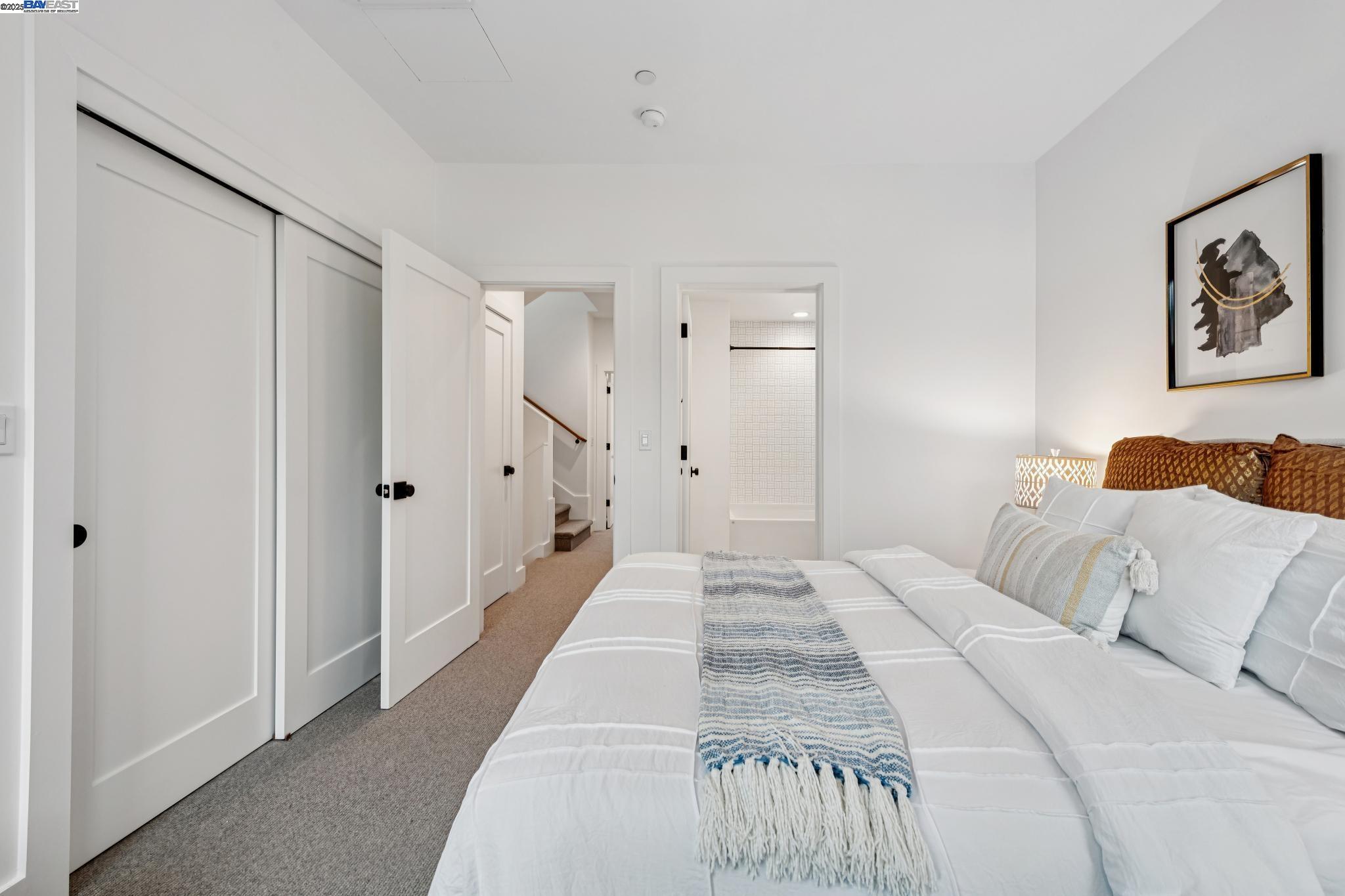 922 Brown Avenue Lafayette, CA 94549 - Photo 28 of 45 a bedroom with a large bed and painting on the wall