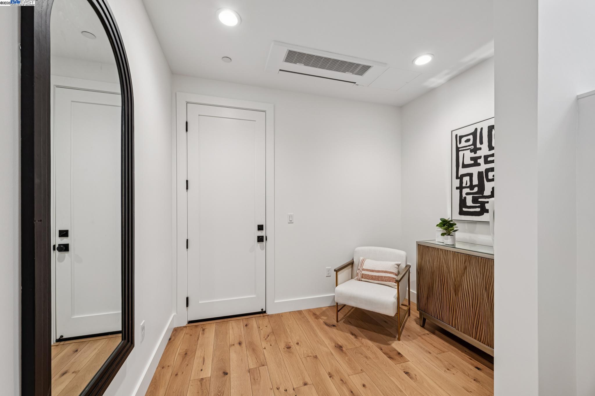 922 Brown Avenue Lafayette, CA 94549 - Photo 32 of 45 a bedroom with a bed and wooden floor