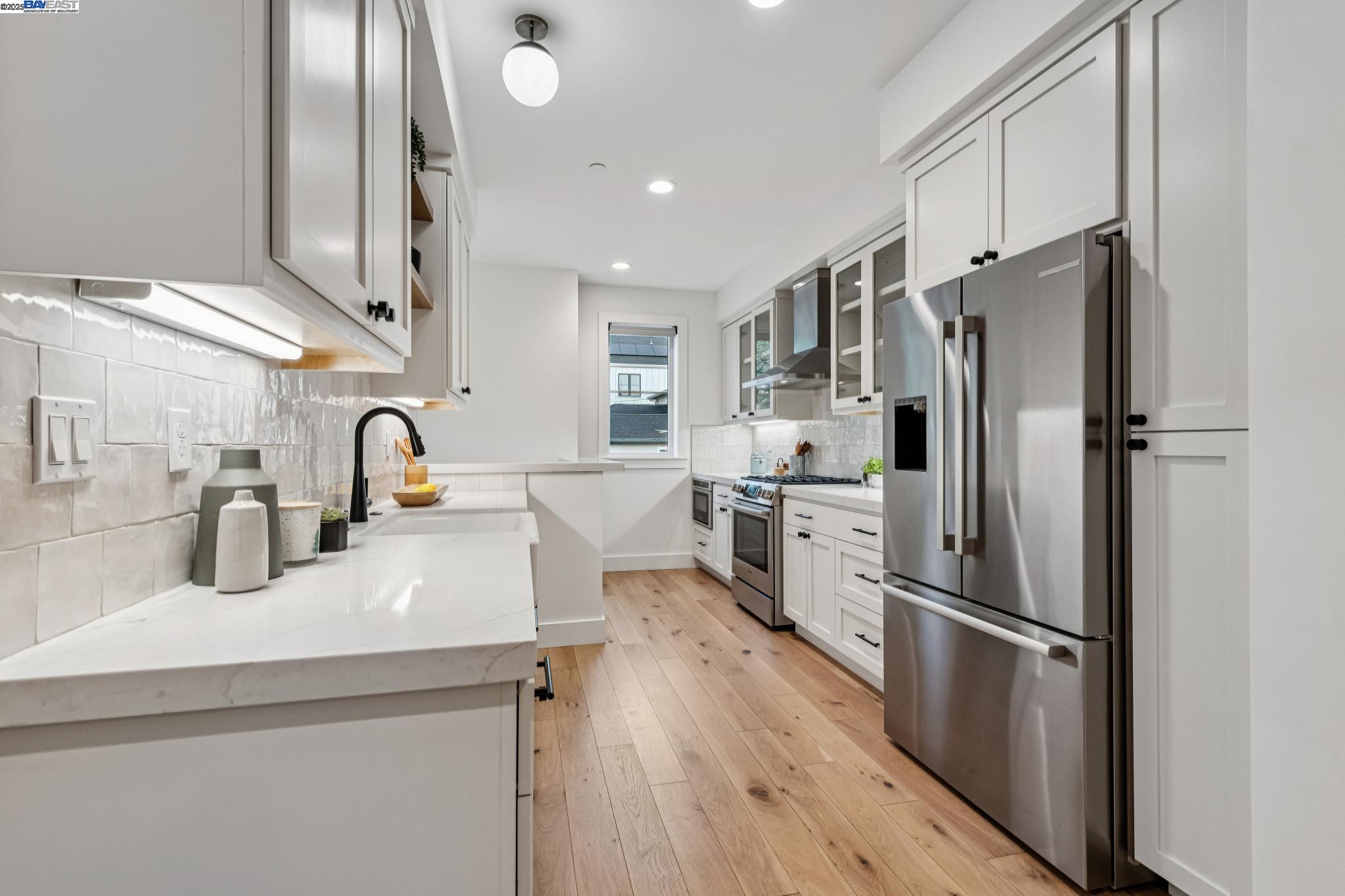 922 Brown Avenue Lafayette, CA 94549 - Photo 9 of 45 a kitchen with stainless steel appliances a refrigerator sink and stove
