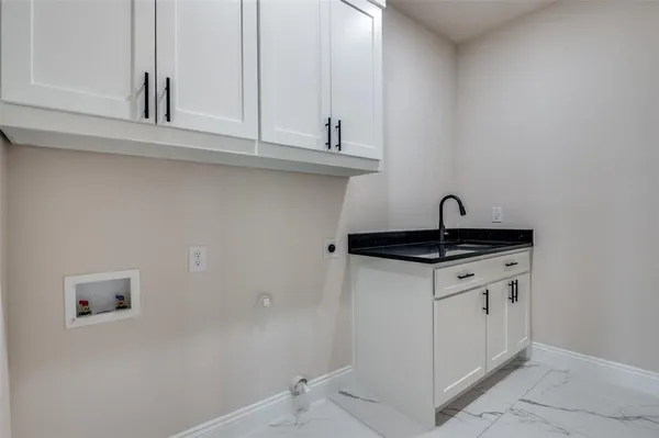 a kitchen with a sink and cabinets