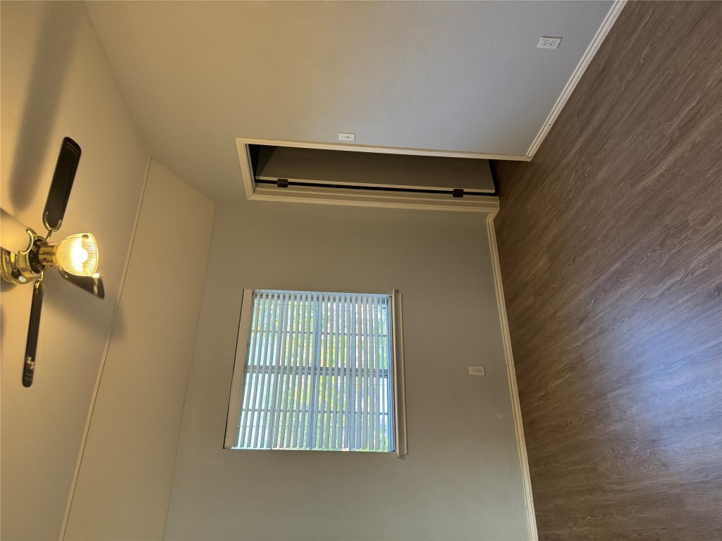 12714 Tantara Drive Austin, TX 78729 - Photo 19 of 25 Spare room featuring vaulted ceiling, dark wood-style flooring, and a ceiling fan