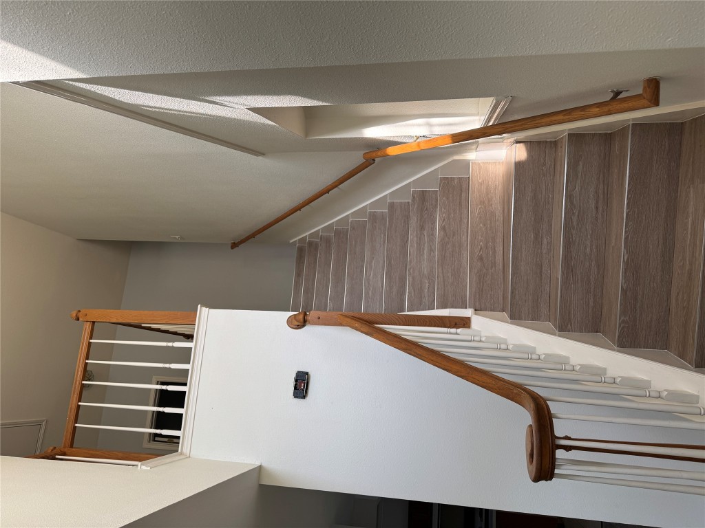 12714 Tantara Drive Austin, TX 78729 - Photo 5 of 25 Stairs featuring wood finished floors