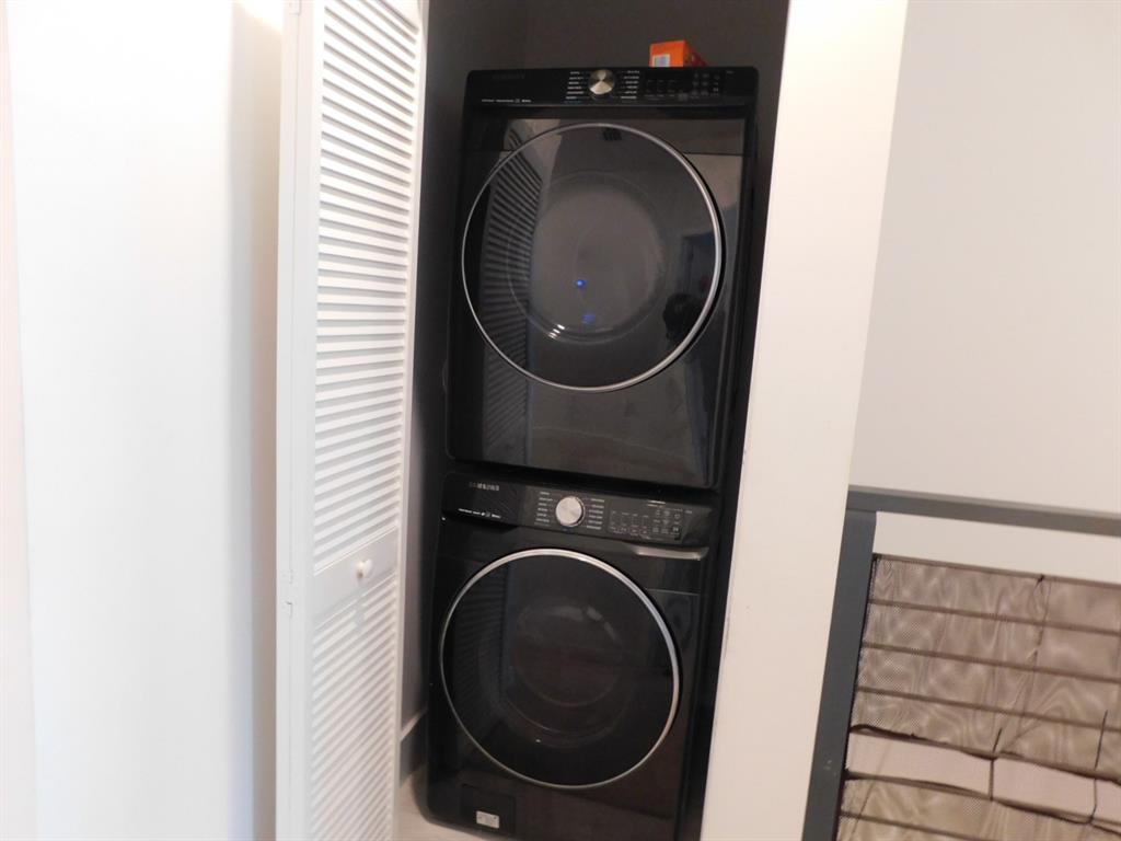 4381 Northwest 9th Street, Unit 4381 Plantation, FL 33317 - Photo 11 of 46 a utility room with dryer and washer