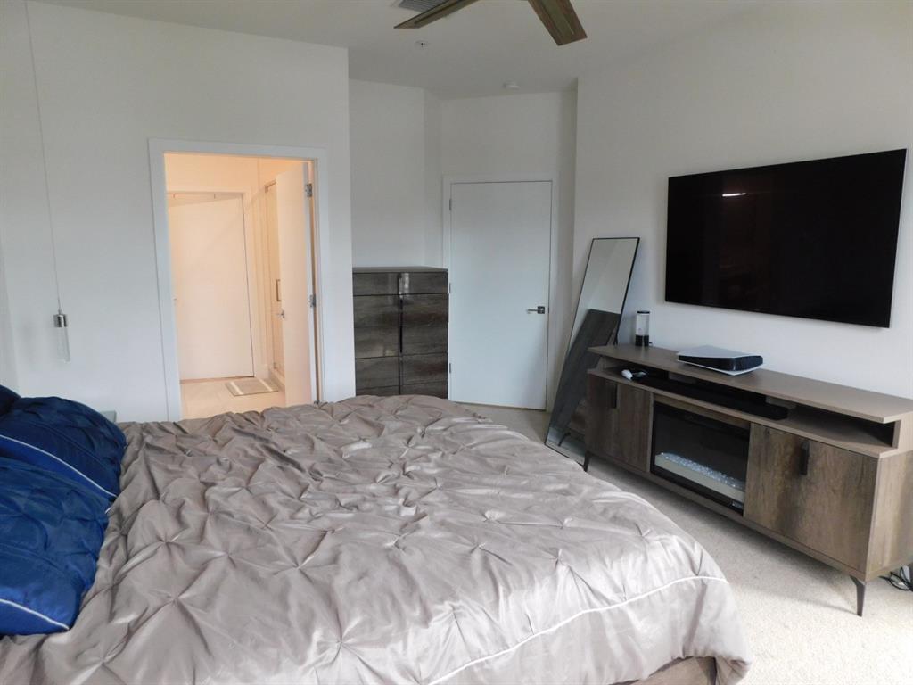 4381 Northwest 9th Street, Unit 4381 Plantation, FL 33317 - Photo 18 of 46 a bedroom with a bed and a television