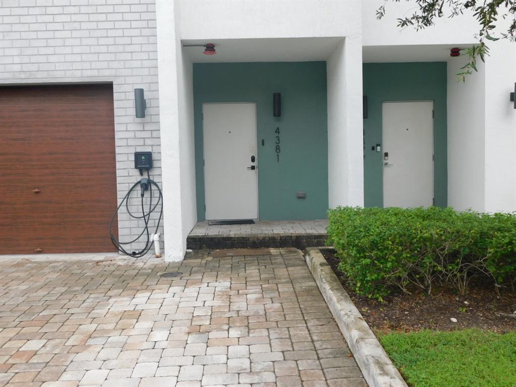4381 Northwest 9th Street, Unit 4381 Plantation, FL 33317 - Photo 2 of 46 a view of a pathway of a house