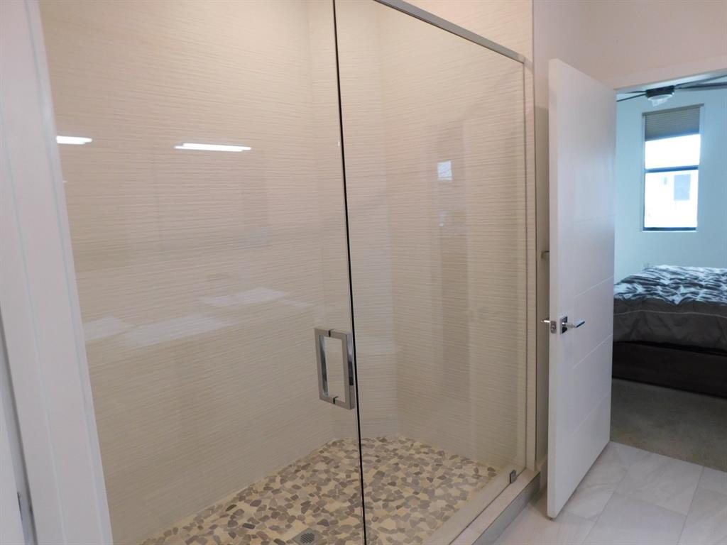 4381 Northwest 9th Street, Unit 4381 Plantation, FL 33317 - Photo 22 of 46 a bathroom with a shower