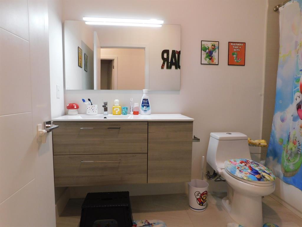 4381 Northwest 9th Street, Unit 4381 Plantation, FL 33317 - Photo 29 of 46 a bathroom with a sink toilet and a mirror