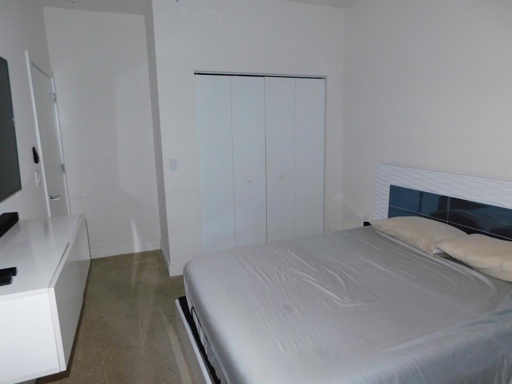 4381 Northwest 9th Street, Unit 4381 Plantation, FL 33317 - Photo 32 of 46 a room with a bed and a rug