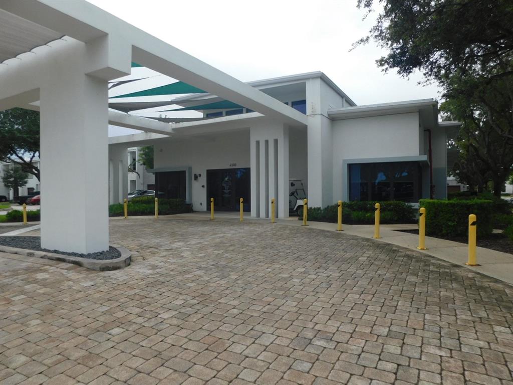 4381 Northwest 9th Street, Unit 4381 Plantation, FL 33317 - Photo 40 of 46 a view of a house with a yard