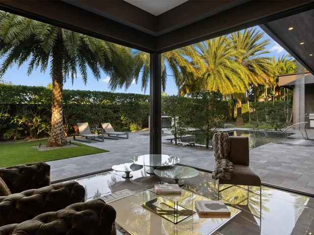 a house with palm tree in front of it