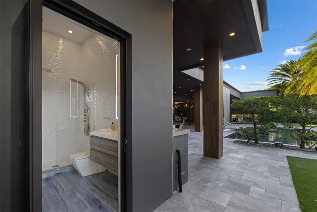 a front view of a building with a garden