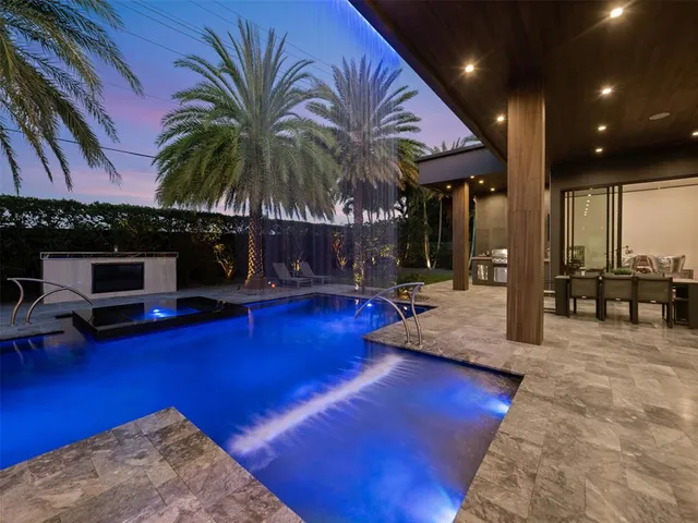 a swimming pool with glass door and glass door