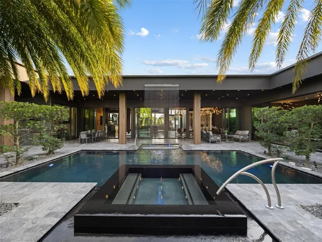 a view of swimming pool with a patio