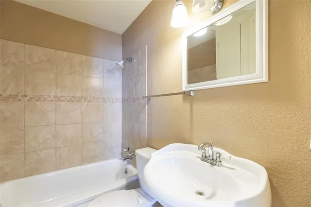 a bathroom with a sink and a bathtub